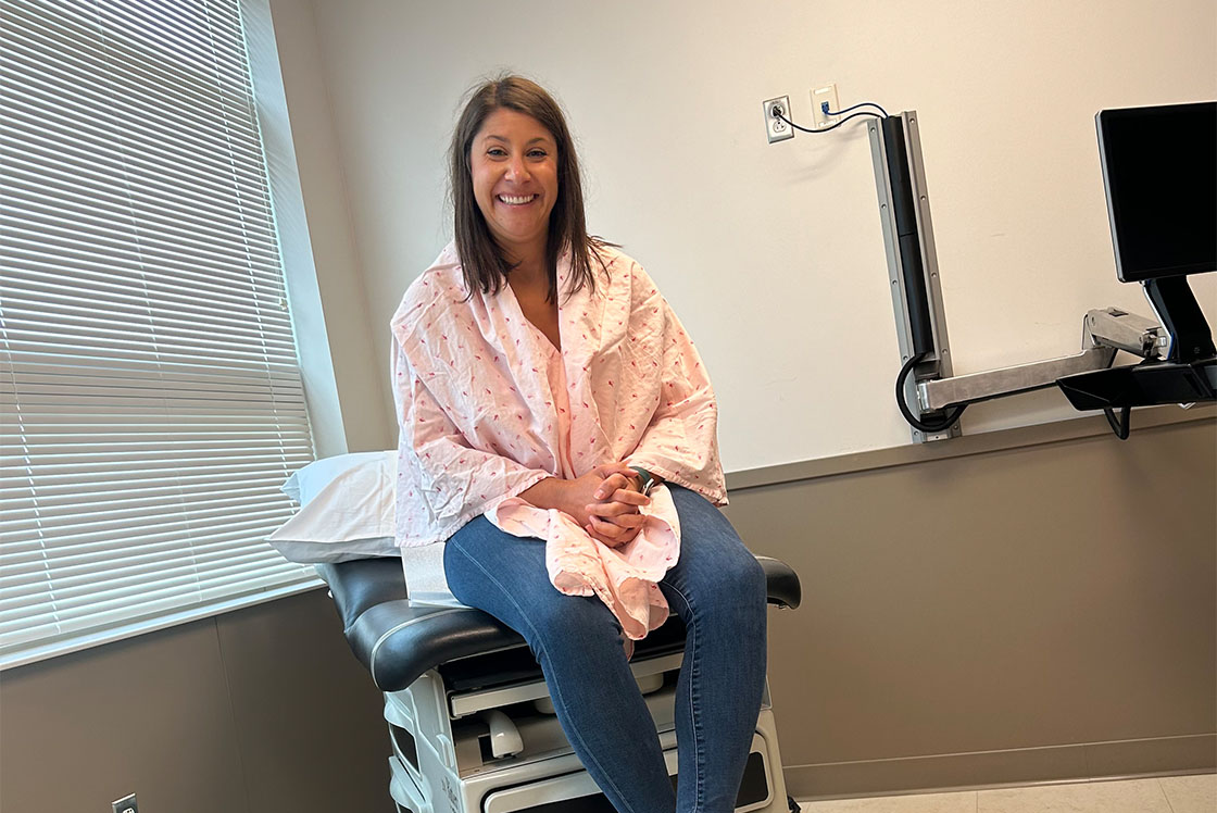 Kayla in the exam room, with family, receiving chemotherapy
