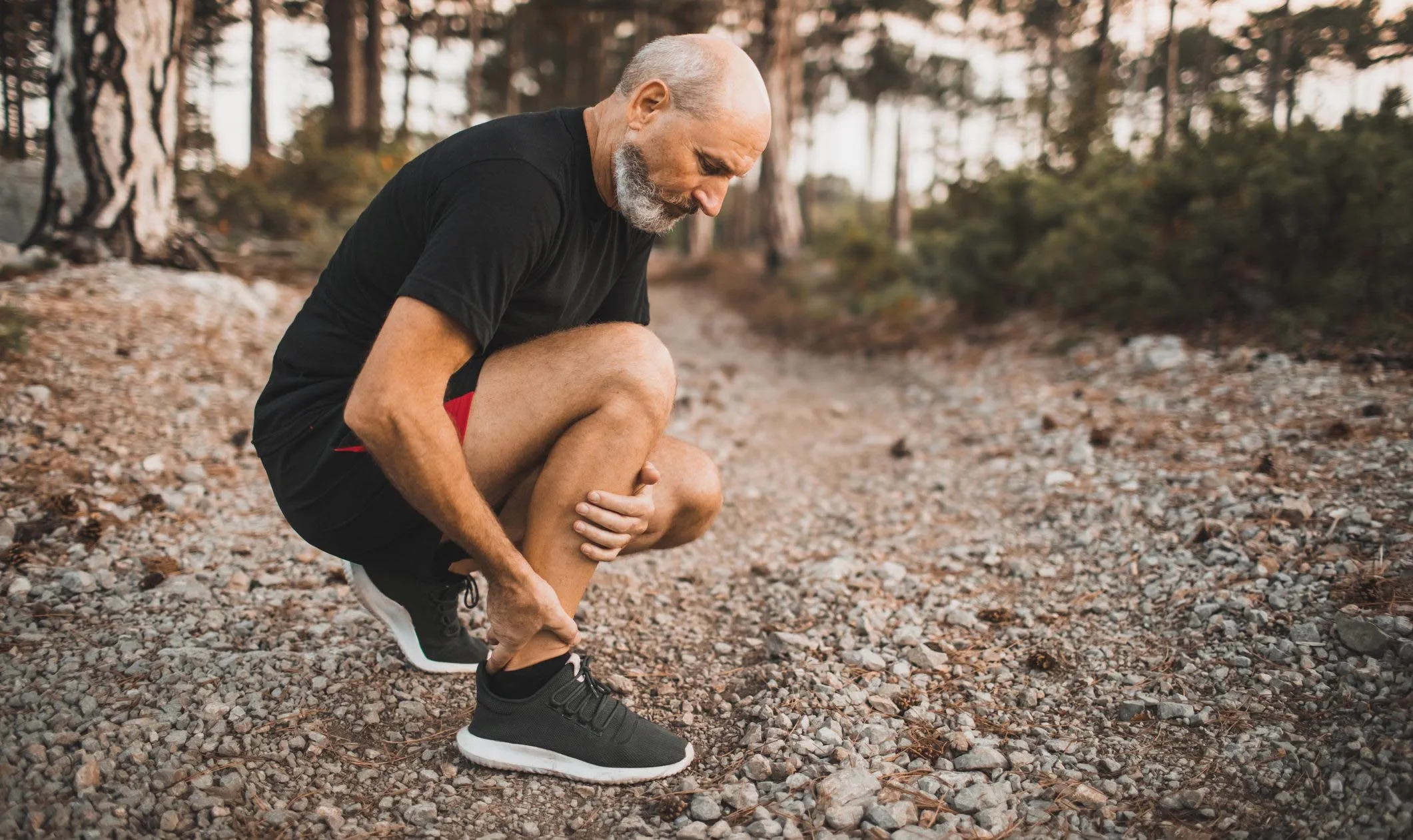 An elderly runner athlete with inflammation of joint or muscle.