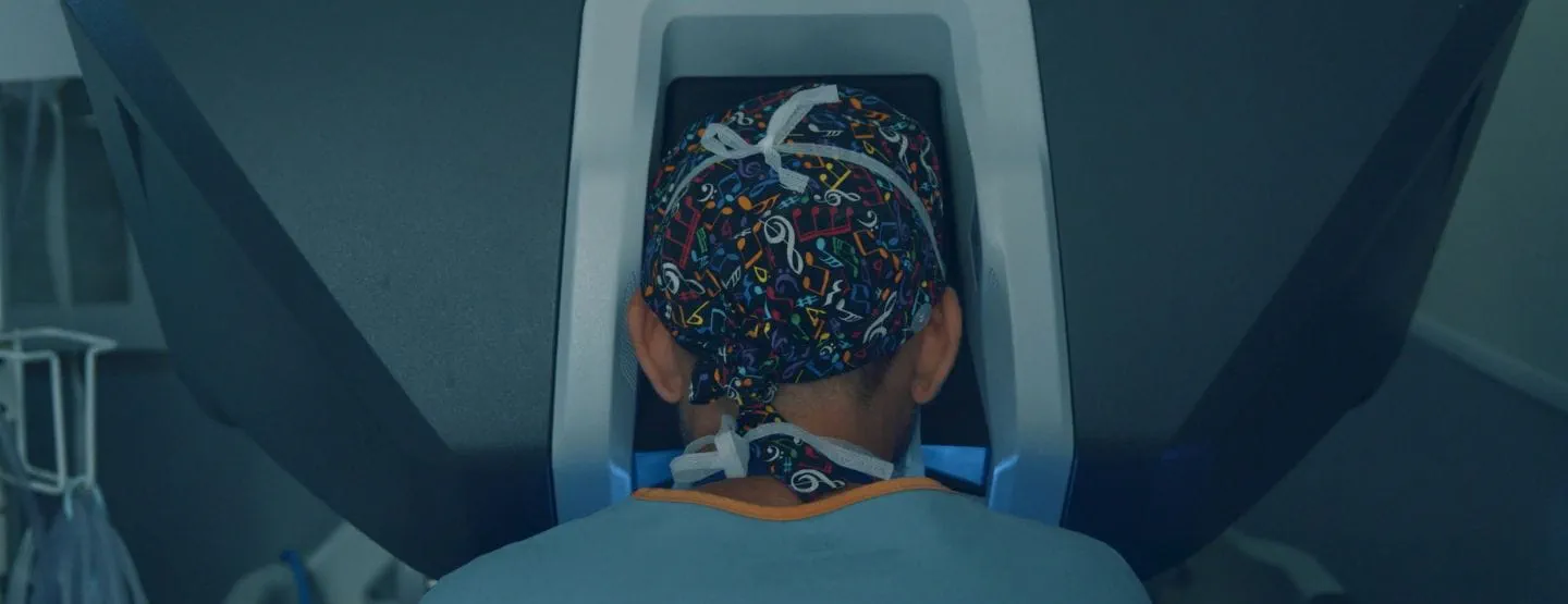Surgeon looking into robotic surgery control console. 