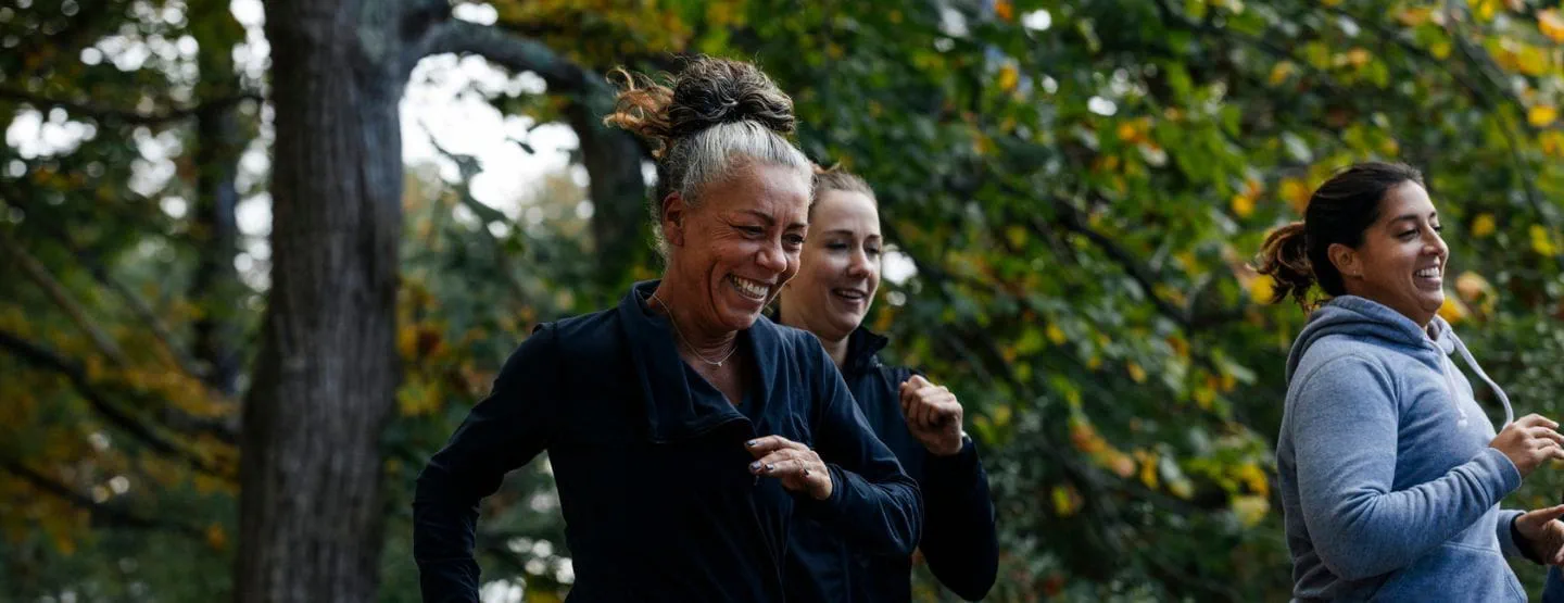 Three women jogging outside