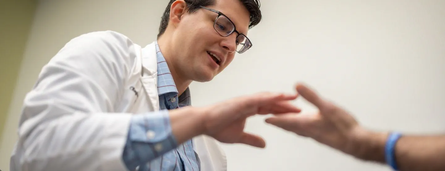 Dr. Buback evaluates patient at the Neurosciences Center ALS clinic. 