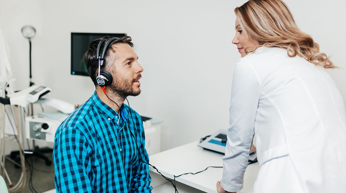 a man receives a hearing test