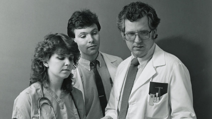 Three ProMedica Medical Professionals talking in 1999