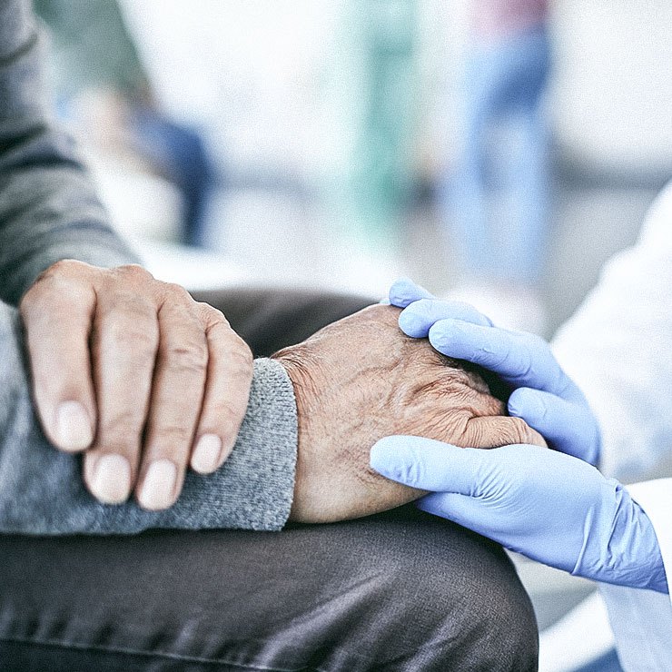 Patient and Caregiver holding hands