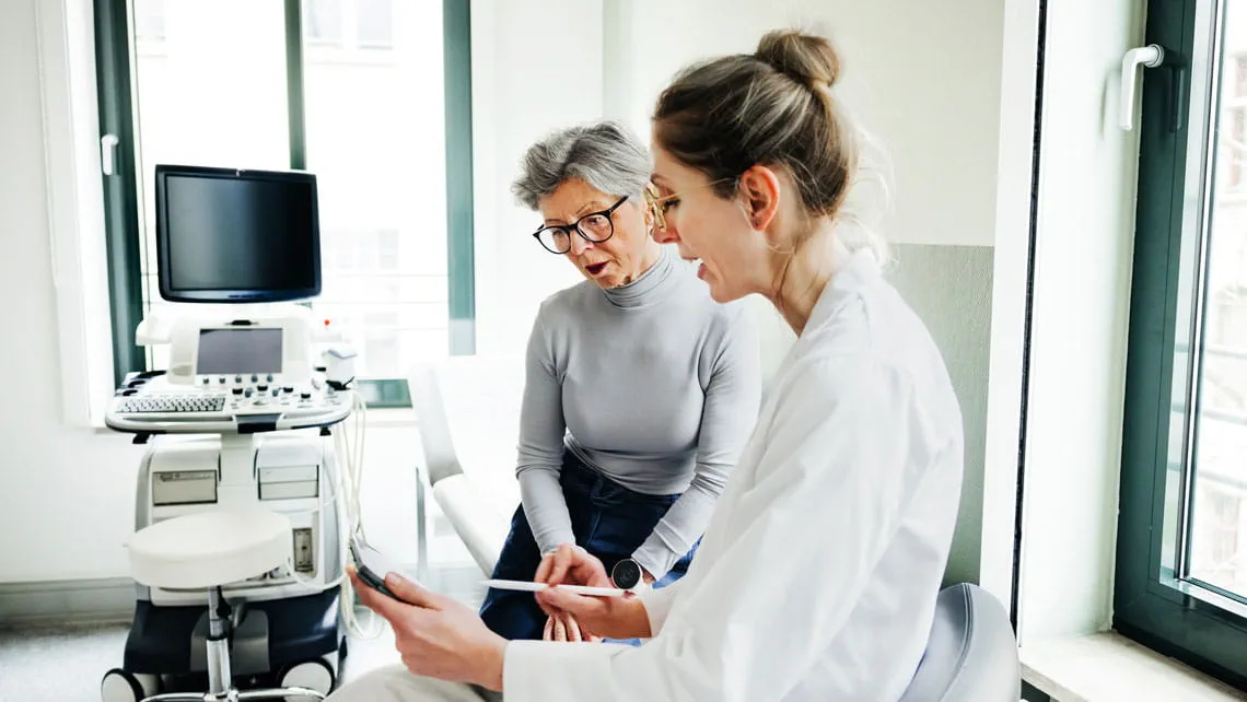 a patient discusses the results of their vascular ultrasound with their physician