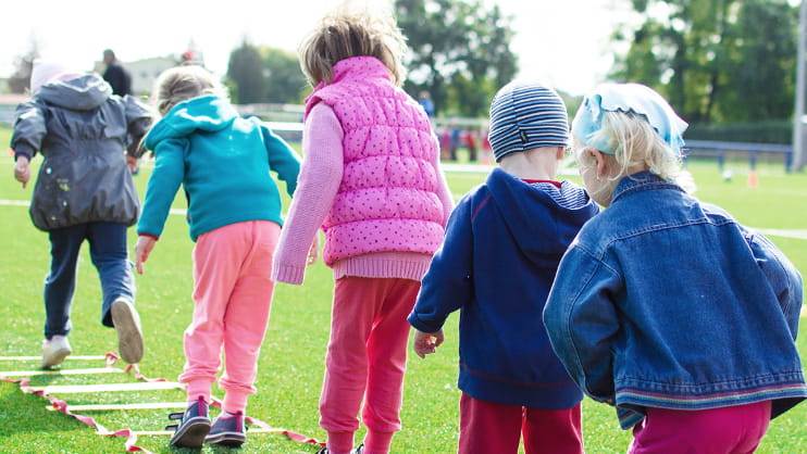 Elementary school children play at a safe neighborhood recreation center