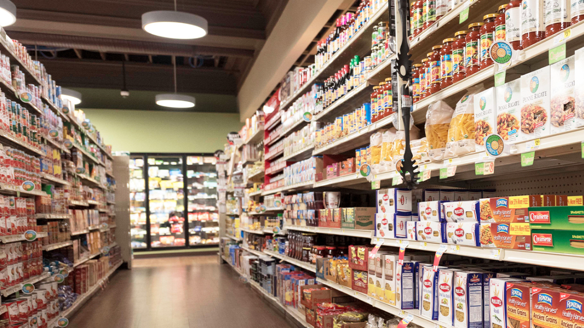 The stocked aisle of a grocery store that participates in the ProMedica Ebeid Neighborhood Promise program