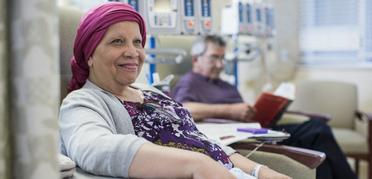 A senior female cancer patient going through treatment.