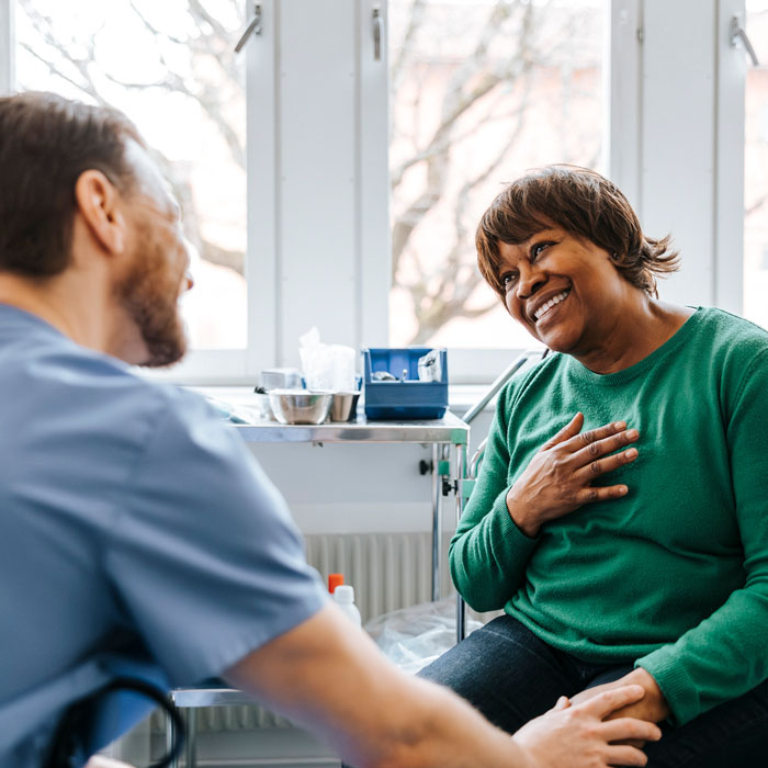 a woman consults with a physician about her upcoming surgery