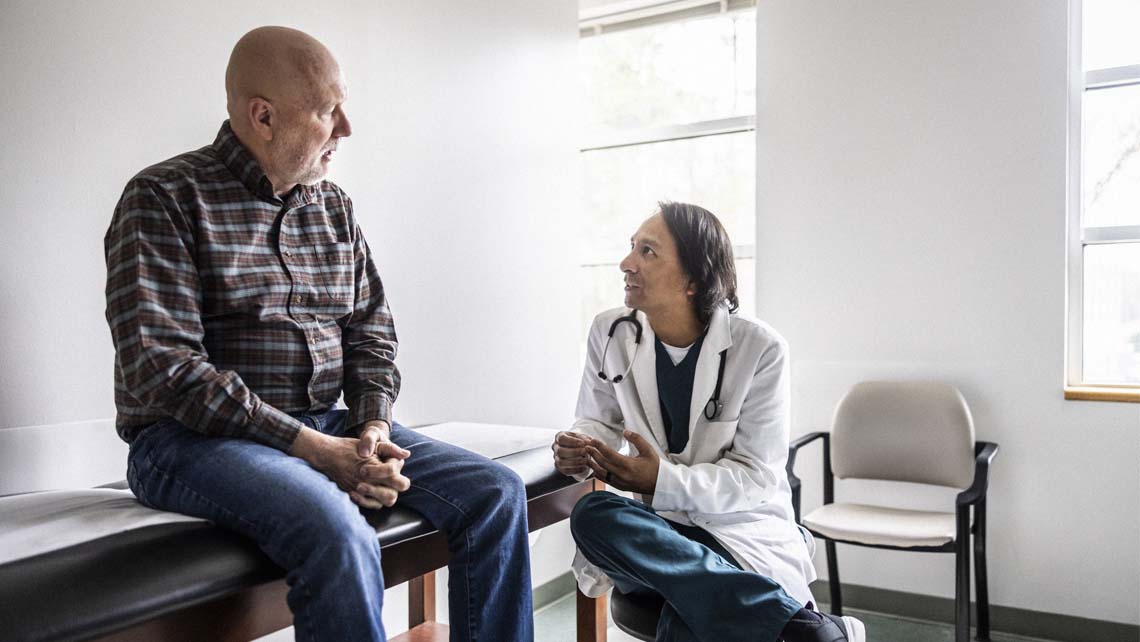 a doctor discusses a clinical trial with a patient