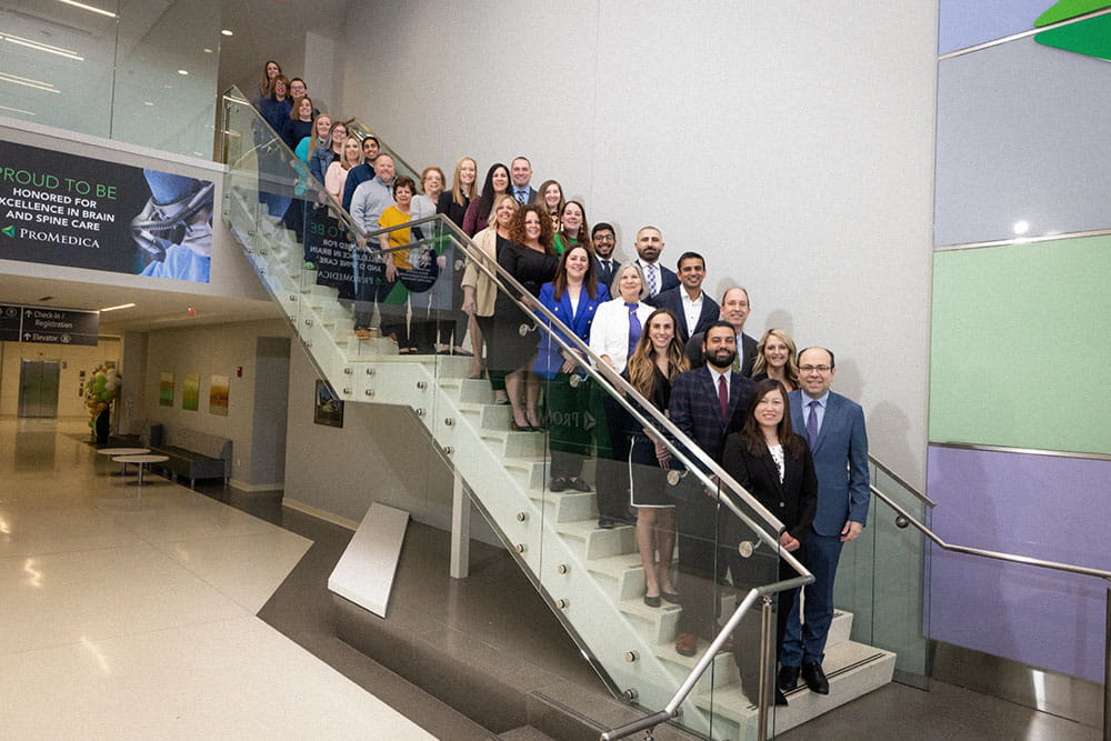 ProMedica Toledo Hospital Stroke Team on the steps of the hospital entrance